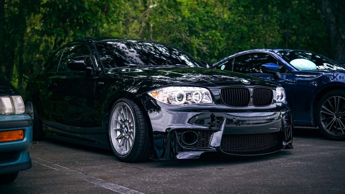 BMW aftermarket body kit on a 3 Series with carbon-look and gloss black finish