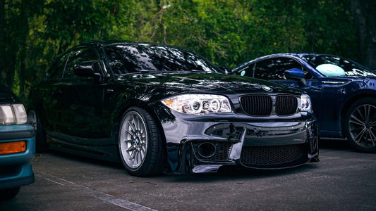 BMW aftermarket body kit on a 3 Series with carbon-look and gloss black finish